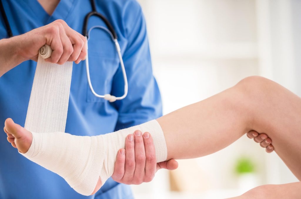 Healthcare professional providing wound care treatment